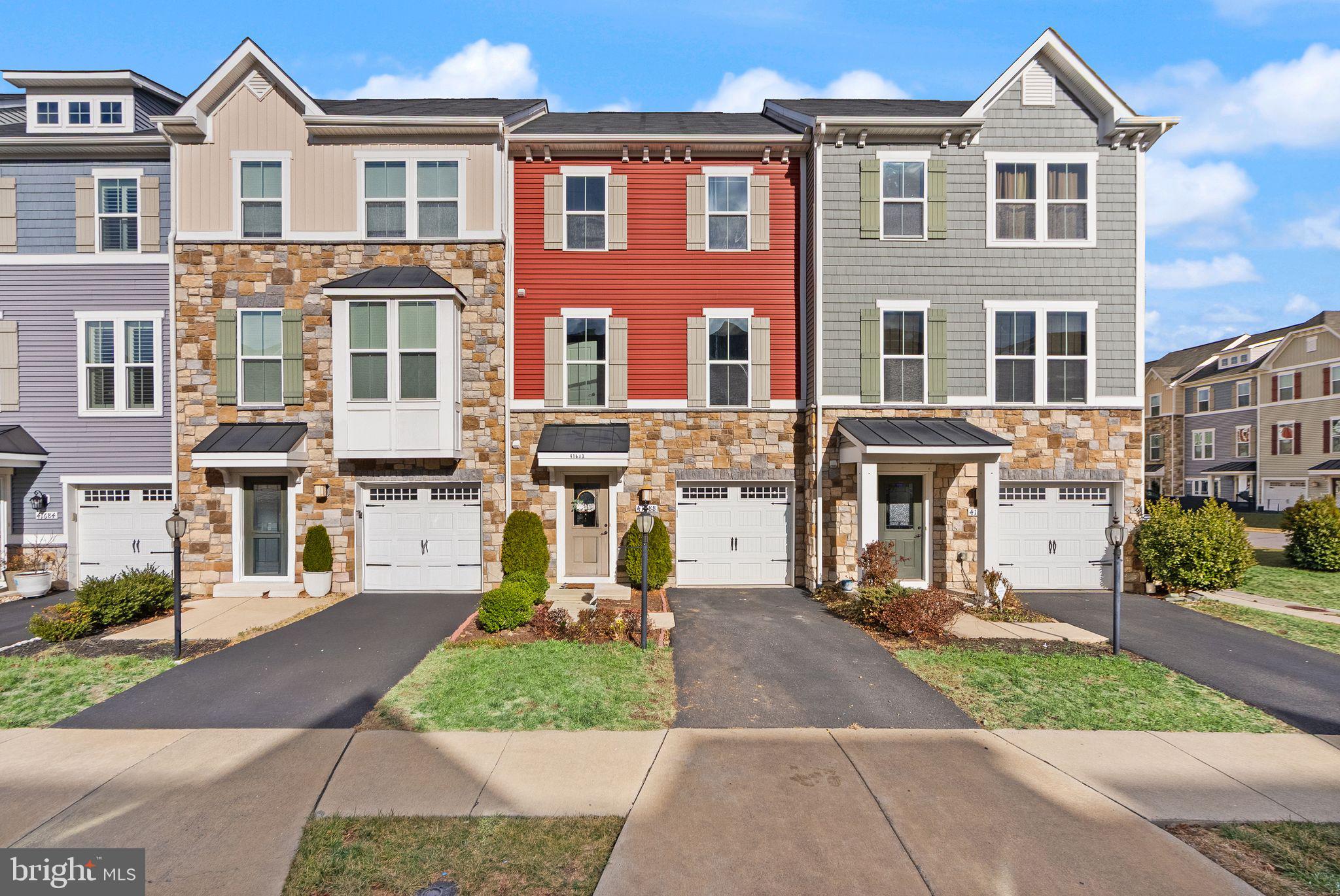 41688 McMonagle Square Aldie, VA 20105 - Photo 2 of 59 front view of a building with a yard