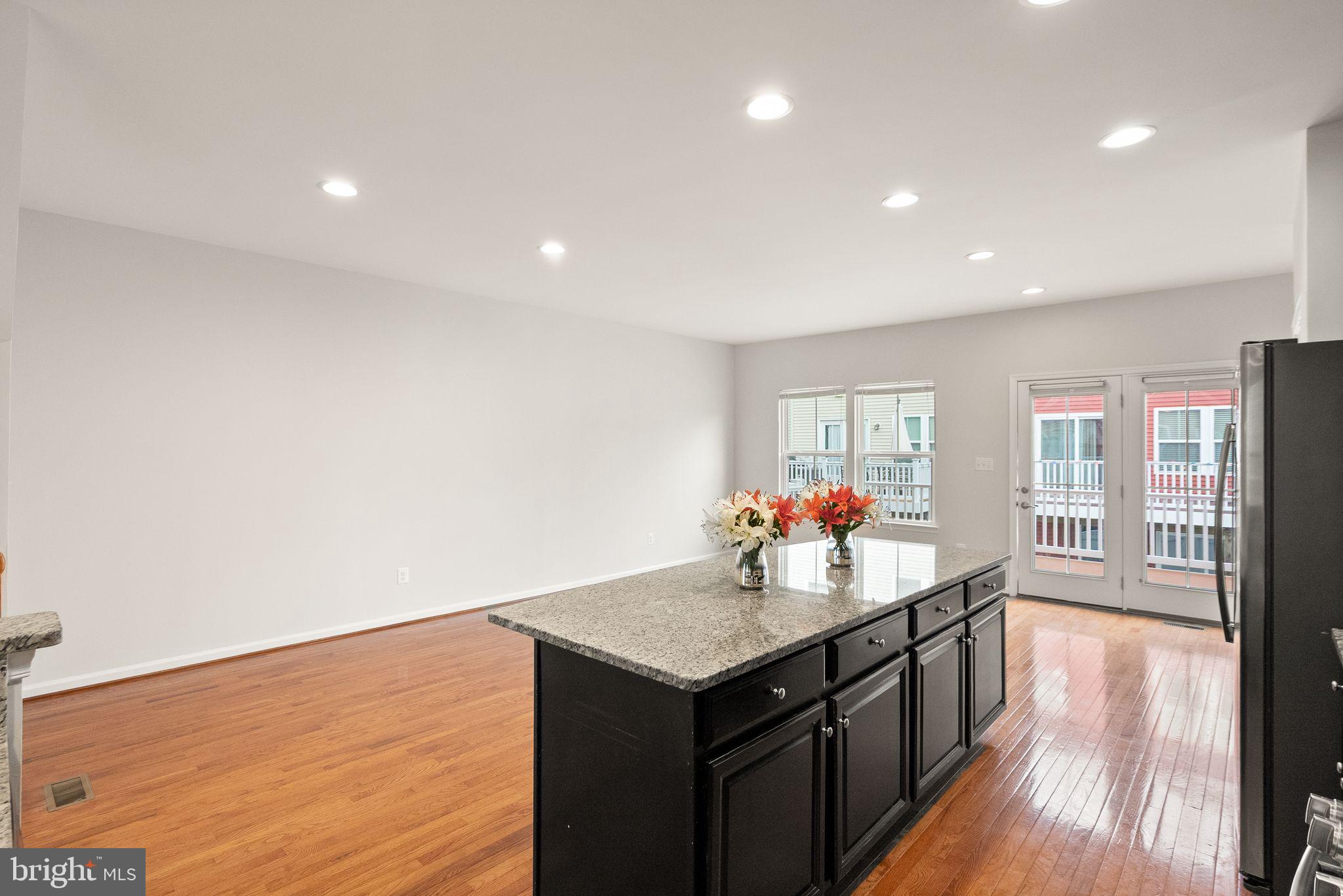41688 McMonagle Square Aldie, VA 20105 - Photo 21 of 59 a kitchen with a stove and a refrigerator