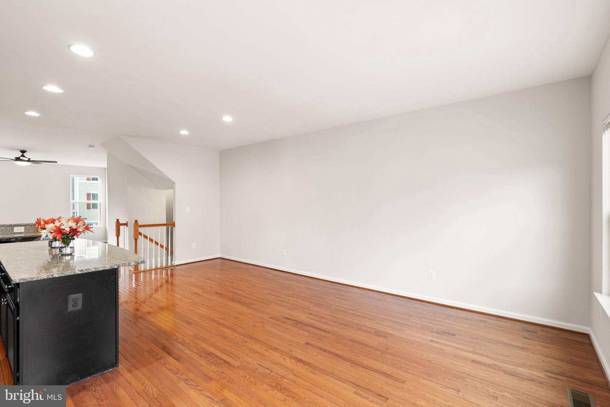 41688 McMonagle Square Aldie, VA 20105 - Photo 23 of 59 a view of a livingroom with wooden floor
