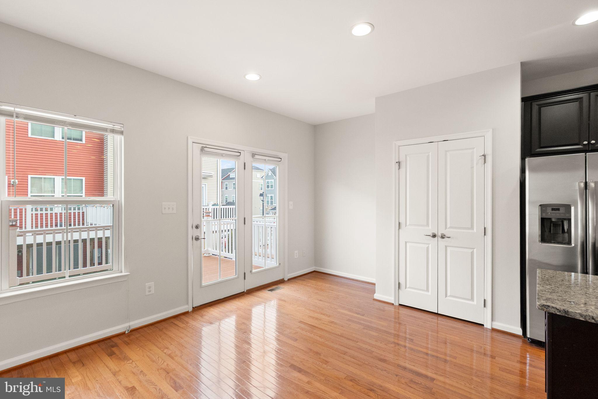 41688 McMonagle Square Aldie, VA 20105 - Photo 27 of 59 a view of an empty room with window and wooden floor