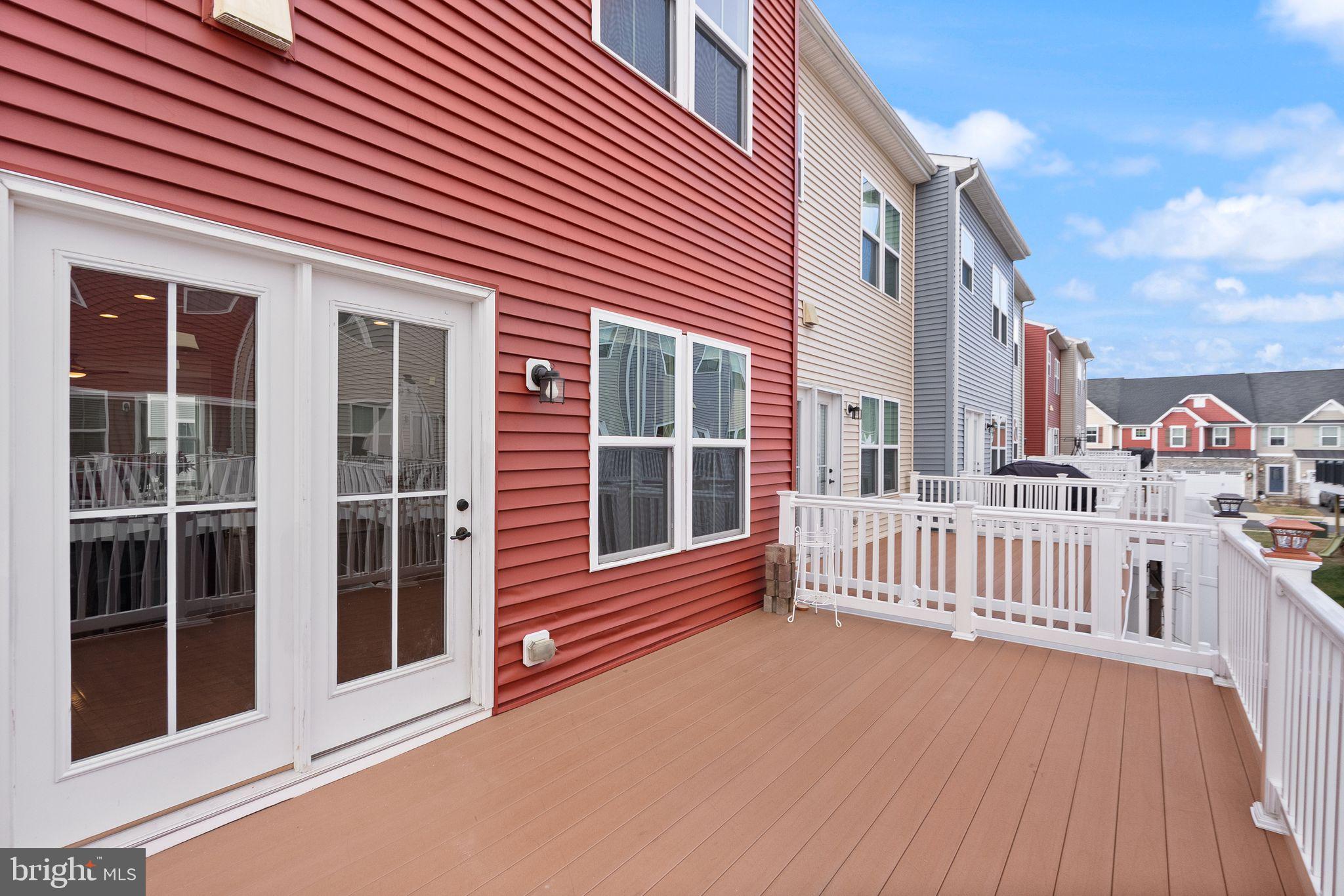 41688 McMonagle Square Aldie, VA 20105 - Photo 29 of 59 a view of a house with deck and a yard