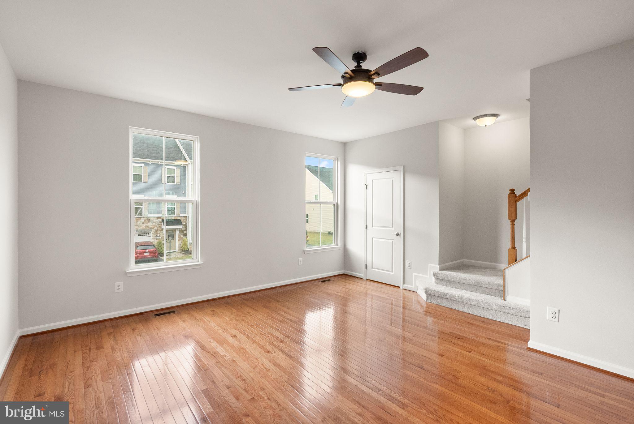 41688 McMonagle Square Aldie, VA 20105 - Photo 32 of 59 a view of an empty room with wooden floor and a window