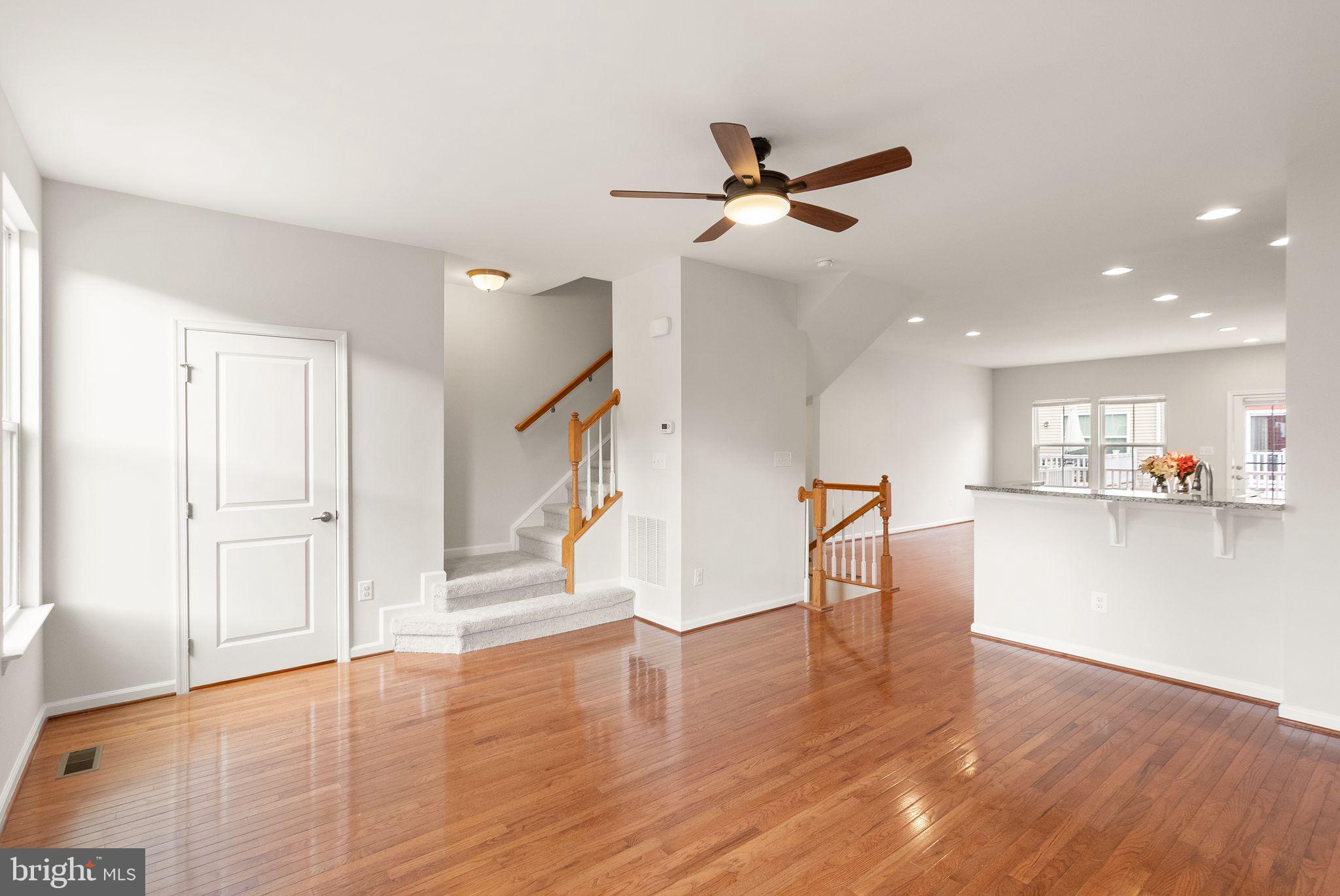 41688 McMonagle Square Aldie, VA 20105 - Photo 33 of 59 a view of a room with wooden floor and a ceiling fan