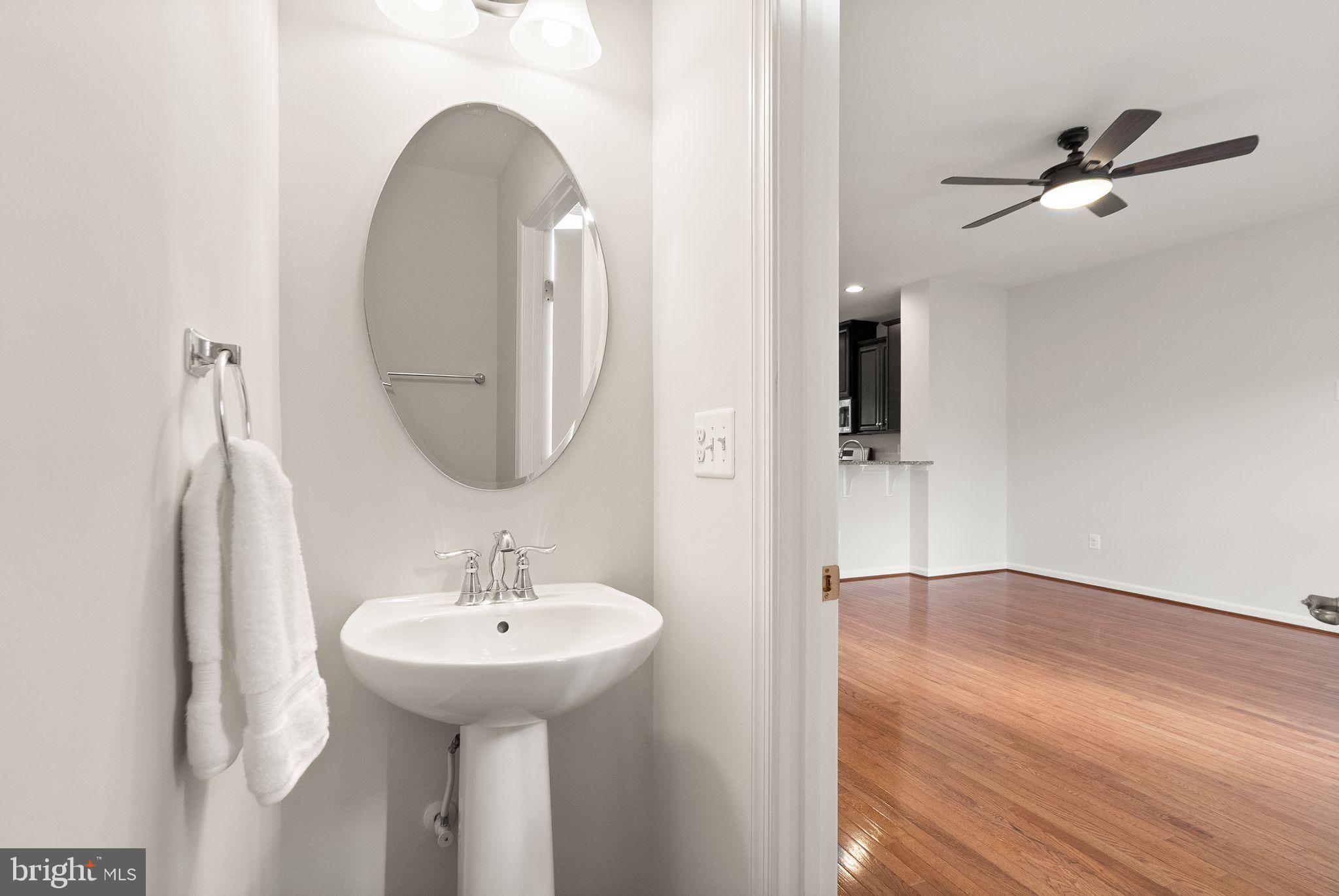 41688 McMonagle Square Aldie, VA 20105 - Photo 35 of 59 a bathroom with a sink and a mirror