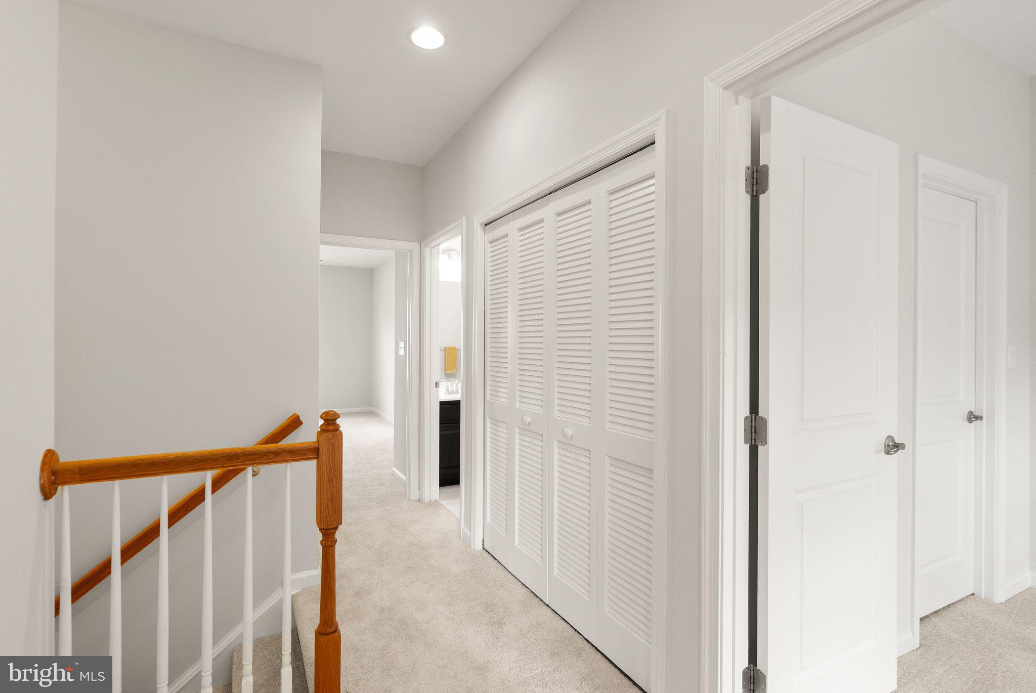 41688 McMonagle Square Aldie, VA 20105 - Photo 36 of 59 a view of a hallway with a white door
