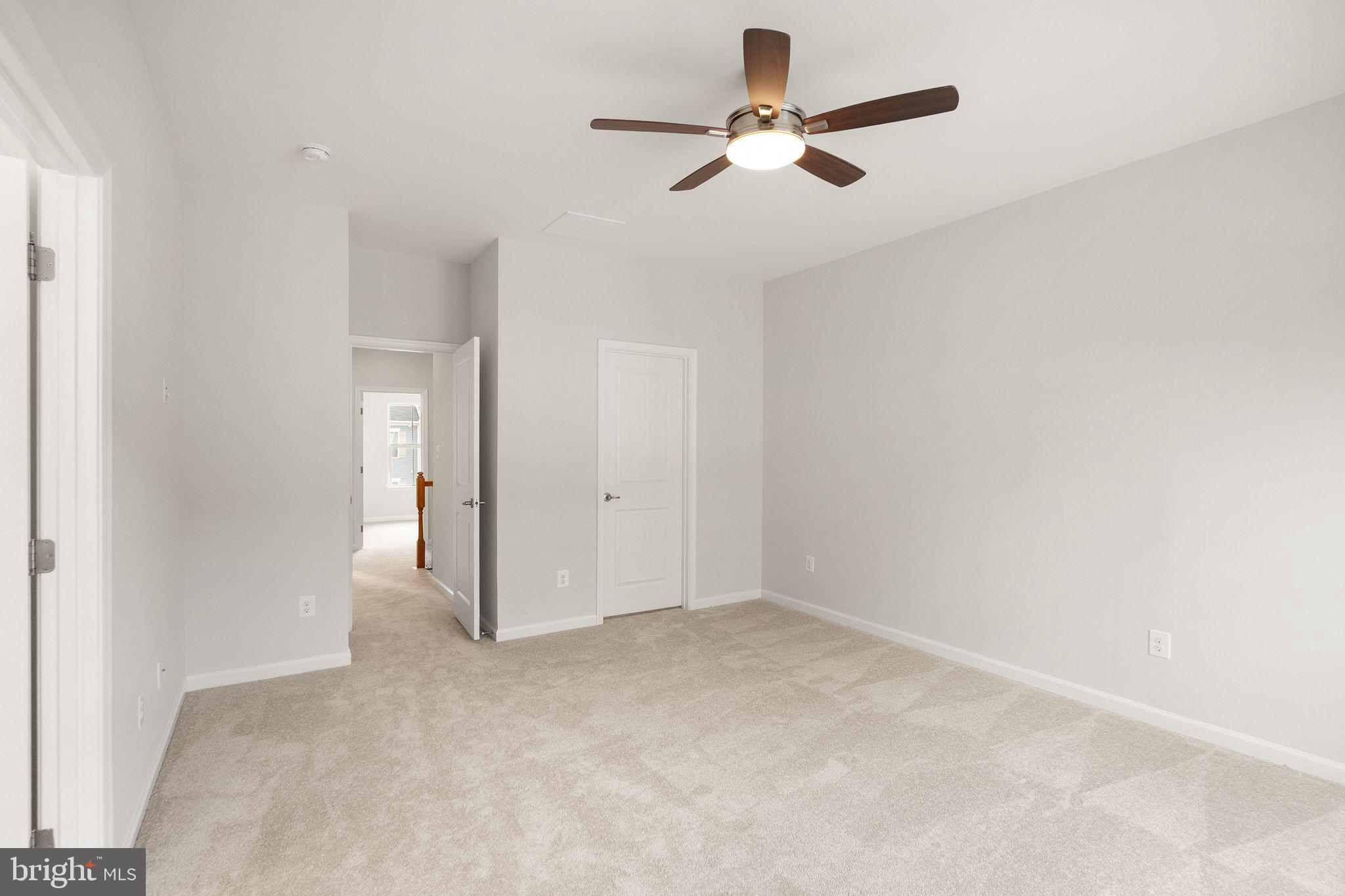 41688 McMonagle Square Aldie, VA 20105 - Photo 40 of 59 an empty room with a ceiling fan and a window