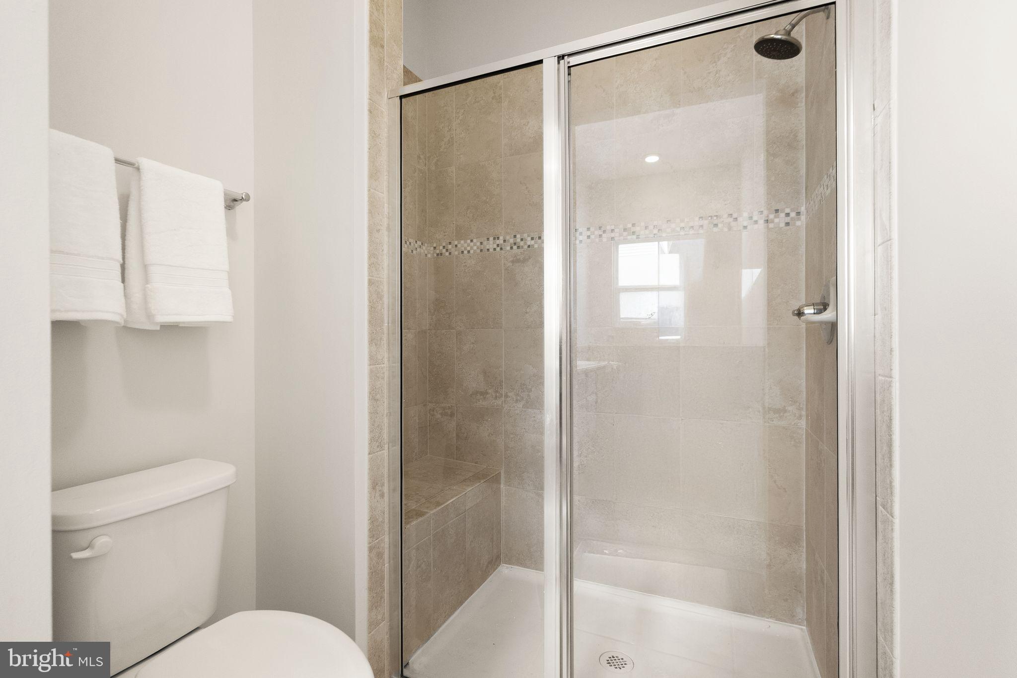 41688 McMonagle Square Aldie, VA 20105 - Photo 43 of 59 a bathroom with a shower and a toilet