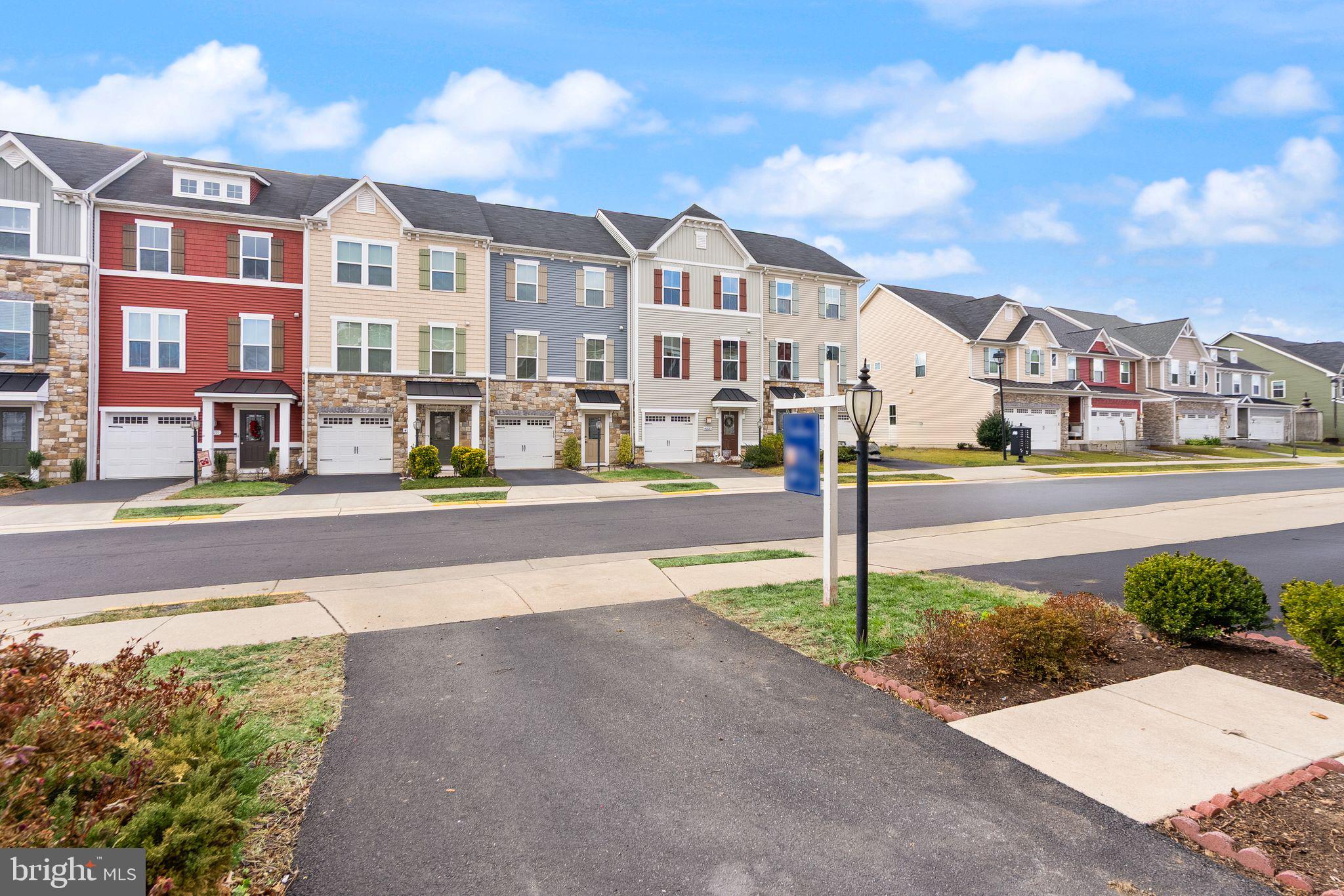 41688 McMonagle Square Aldie, VA 20105 - Photo 6 of 59 a street view with tall buildings