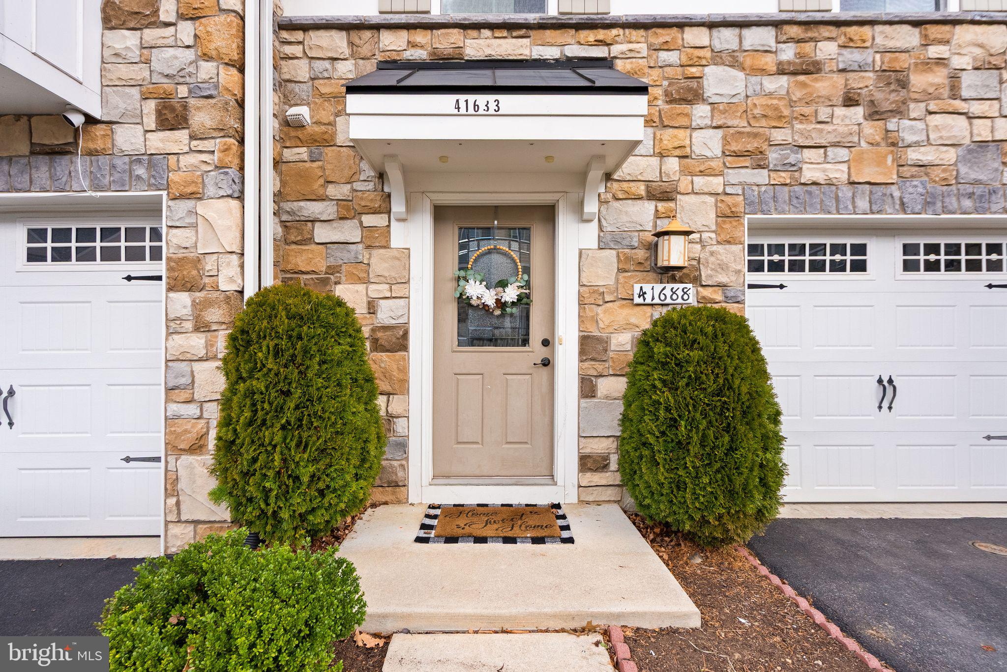 41688 McMonagle Square Aldie, VA 20105 - Photo 8 of 59 a view of a entryway front of a building