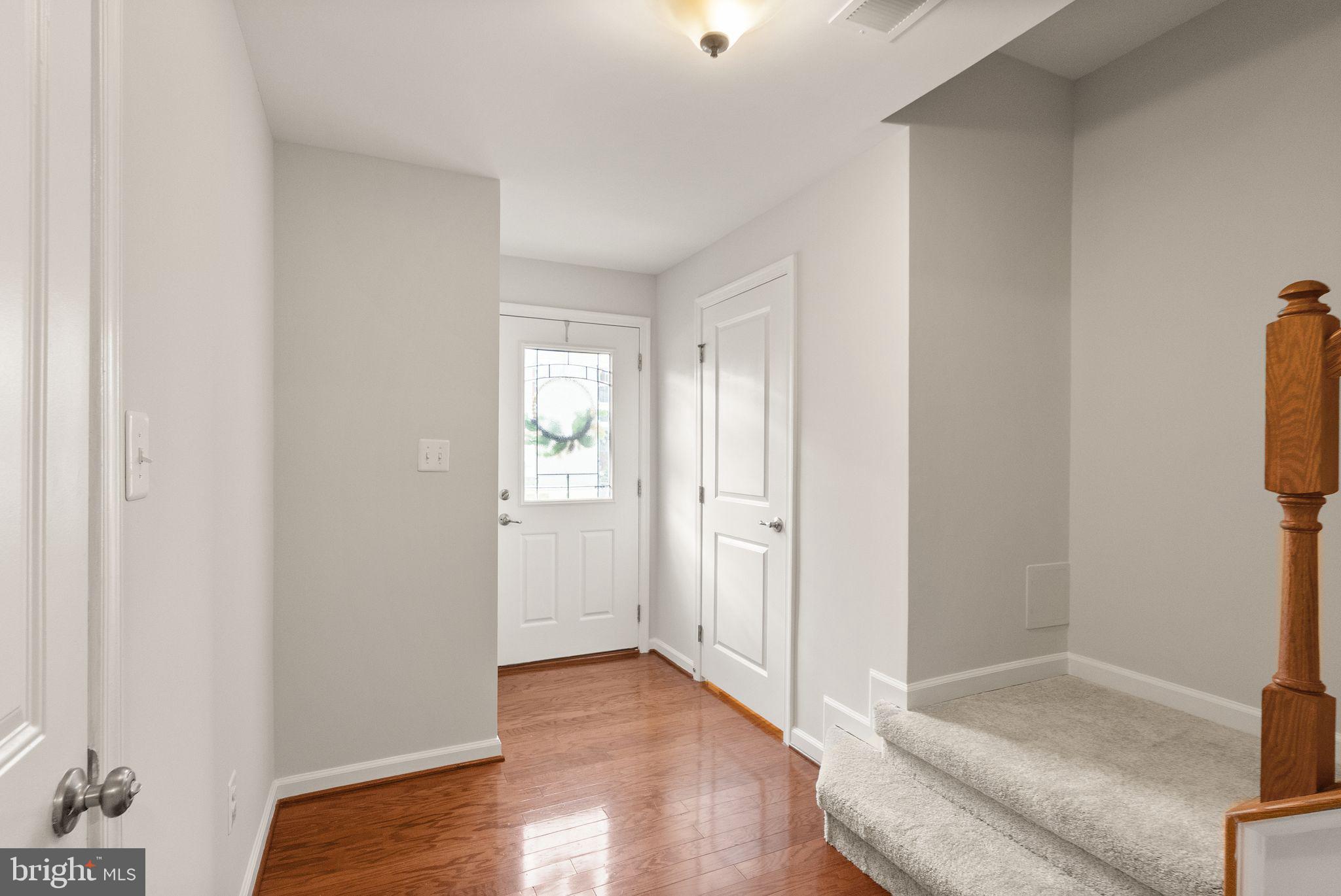 41688 McMonagle Square Aldie, VA 20105 - Photo 10 of 59 a view of livingroom with hardwood floor and hallway