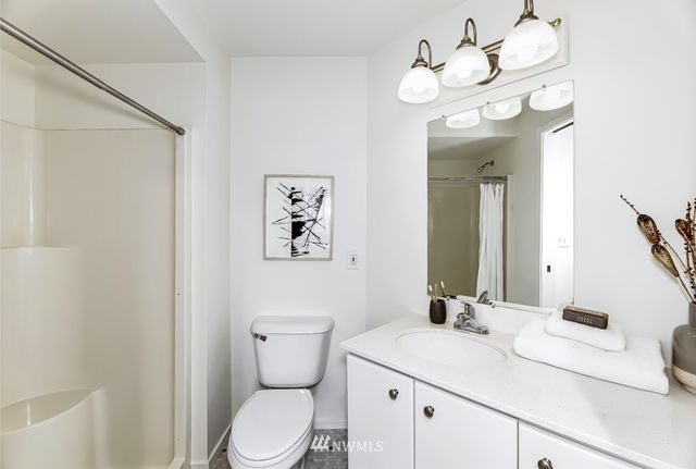 a view of a balcony with two chairs and a table