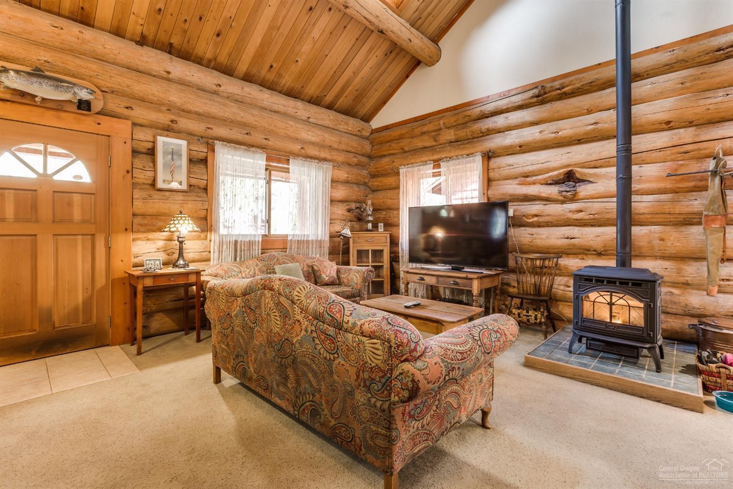 19375 Mohawk Road Bend, OR 97702 - Photo 9 of 25 a living room with furniture and a flat screen tv