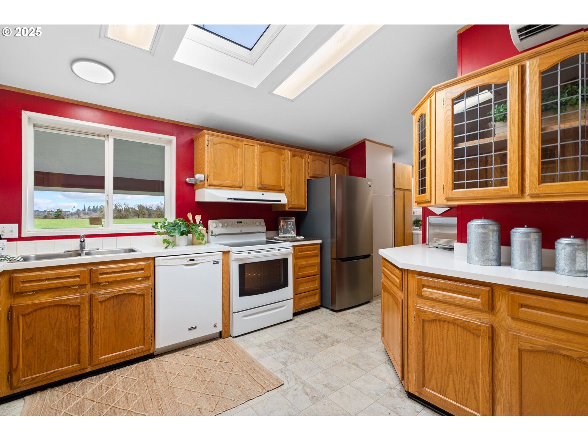 1720 Southwest Stringtown Road Forest Grove, OR 97116 - Photo 13 of 39 a kitchen with stainless steel appliances granite countertop a sink and cabinets