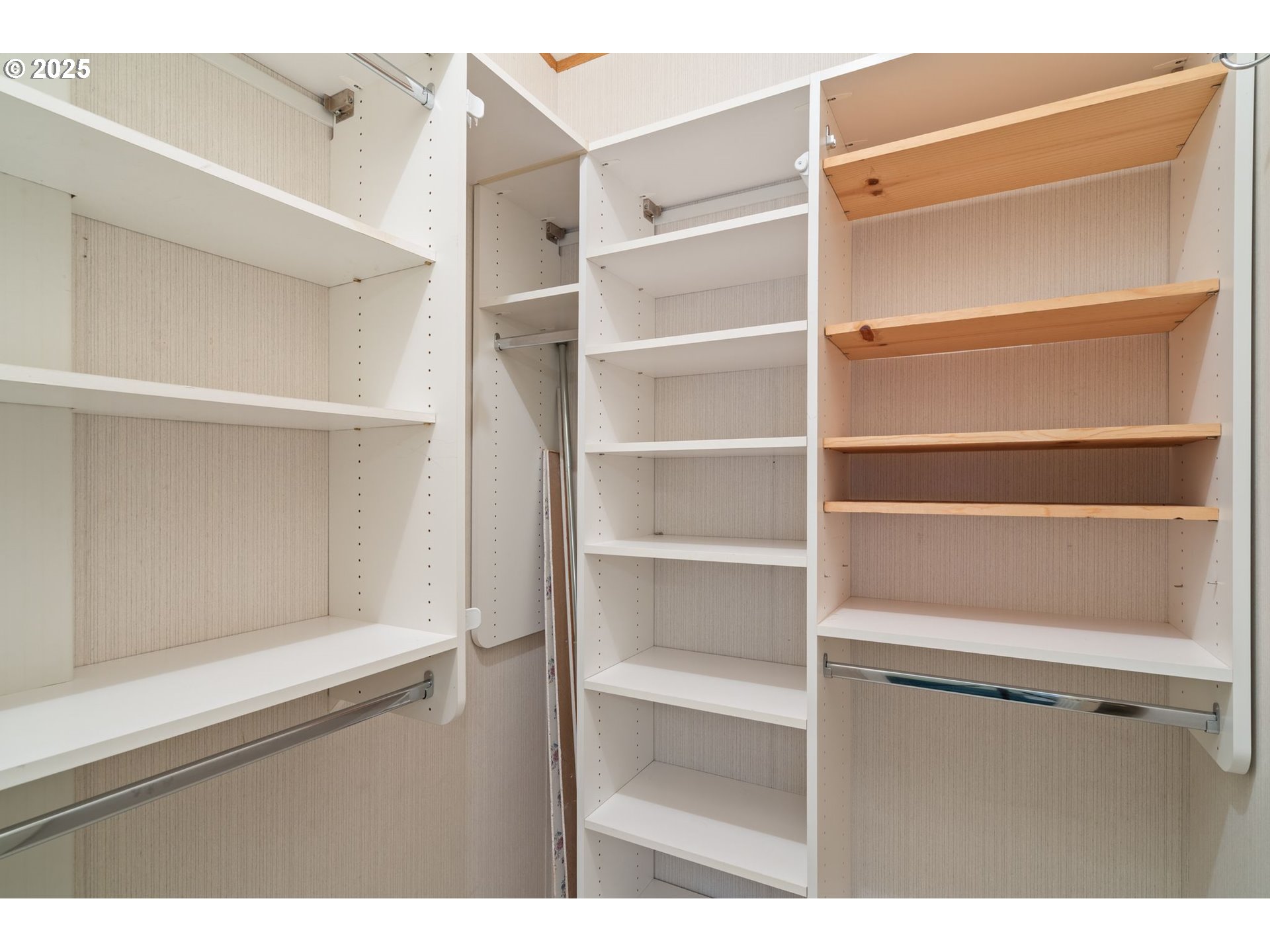 1720 Southwest Stringtown Road Forest Grove, OR 97116 - Photo 18 of 39 a view of walk in closet with empty racks