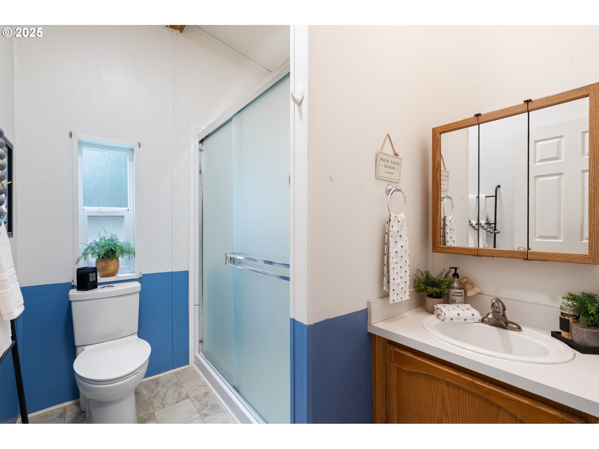 1720 Southwest Stringtown Road Forest Grove, OR 97116 - Photo 24 of 39 a bathroom with a sink a toilet and a mirror