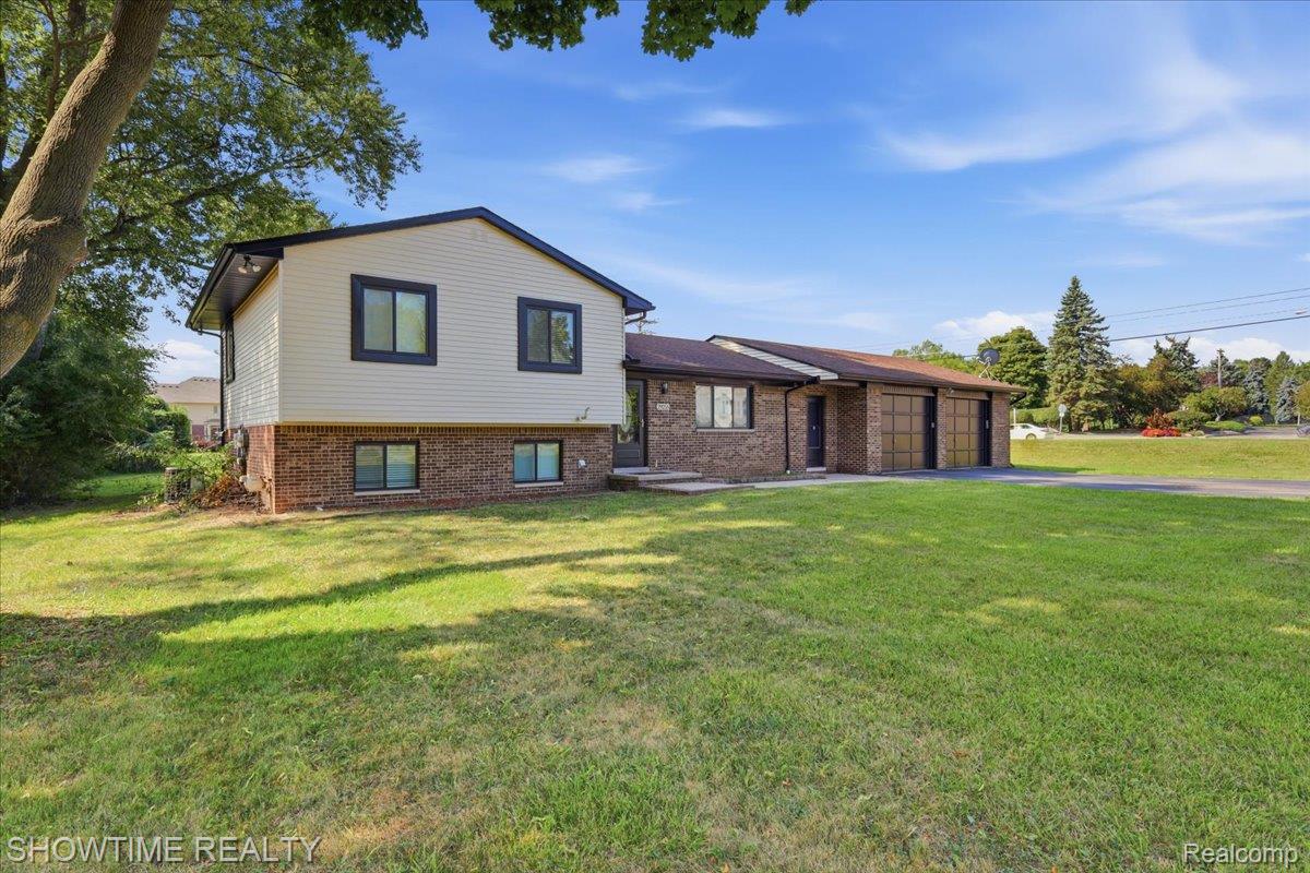 29255 Utley Road Farmington, MI 48334 - Photo 36 of 46 Brick and siding exterior with a multi-level design