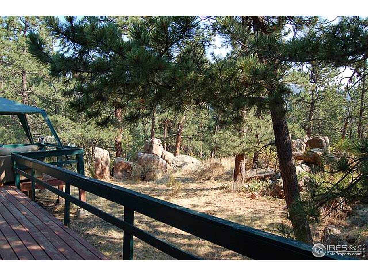 73 Sioux Road Lyons, CO 80540 - Photo 3 of 11 a view of a lake from a balcony