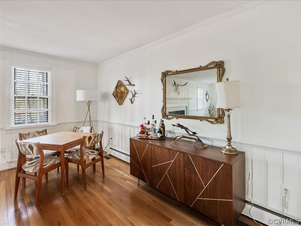 10231 Apache Road Richmond, VA 23235 - Photo 5 of 37 a view of a dining room with furniture and wooden floor