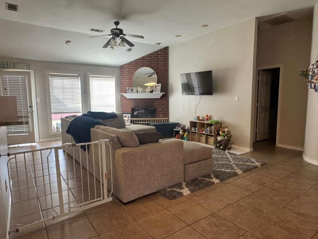11901 Galleon Road Frisco, TX 75035 - Photo 3 of 12 a living room with furniture a flat screen tv and a large window