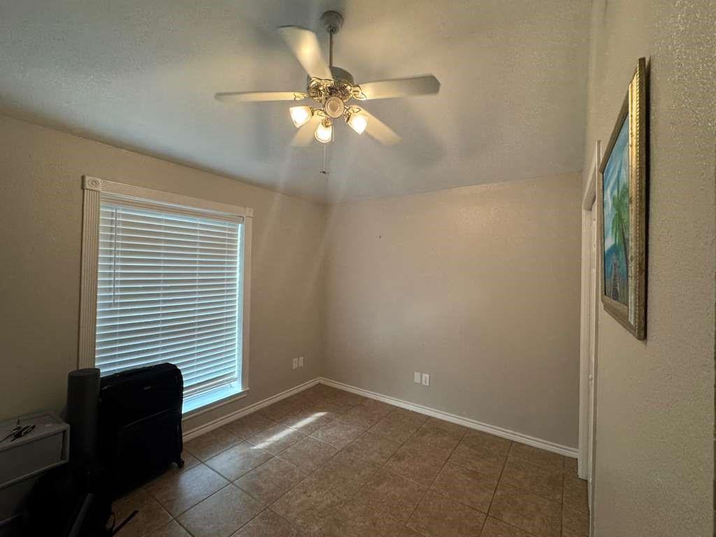 11901 Galleon Road Frisco, TX 75035 - Photo 5 of 12 a view of an empty room with a window