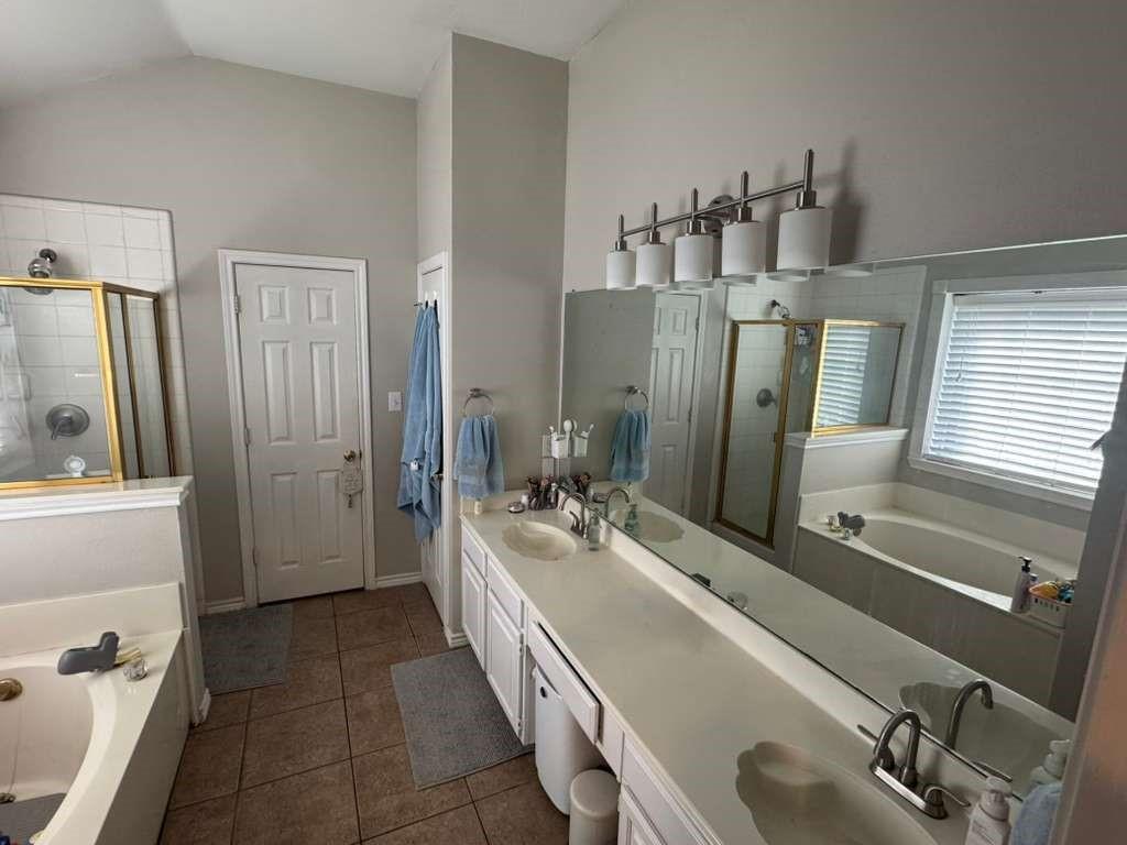 11901 Galleon Road Frisco, TX 75035 - Photo 10 of 12 a bathroom with a double vanity sink a mirror and shower