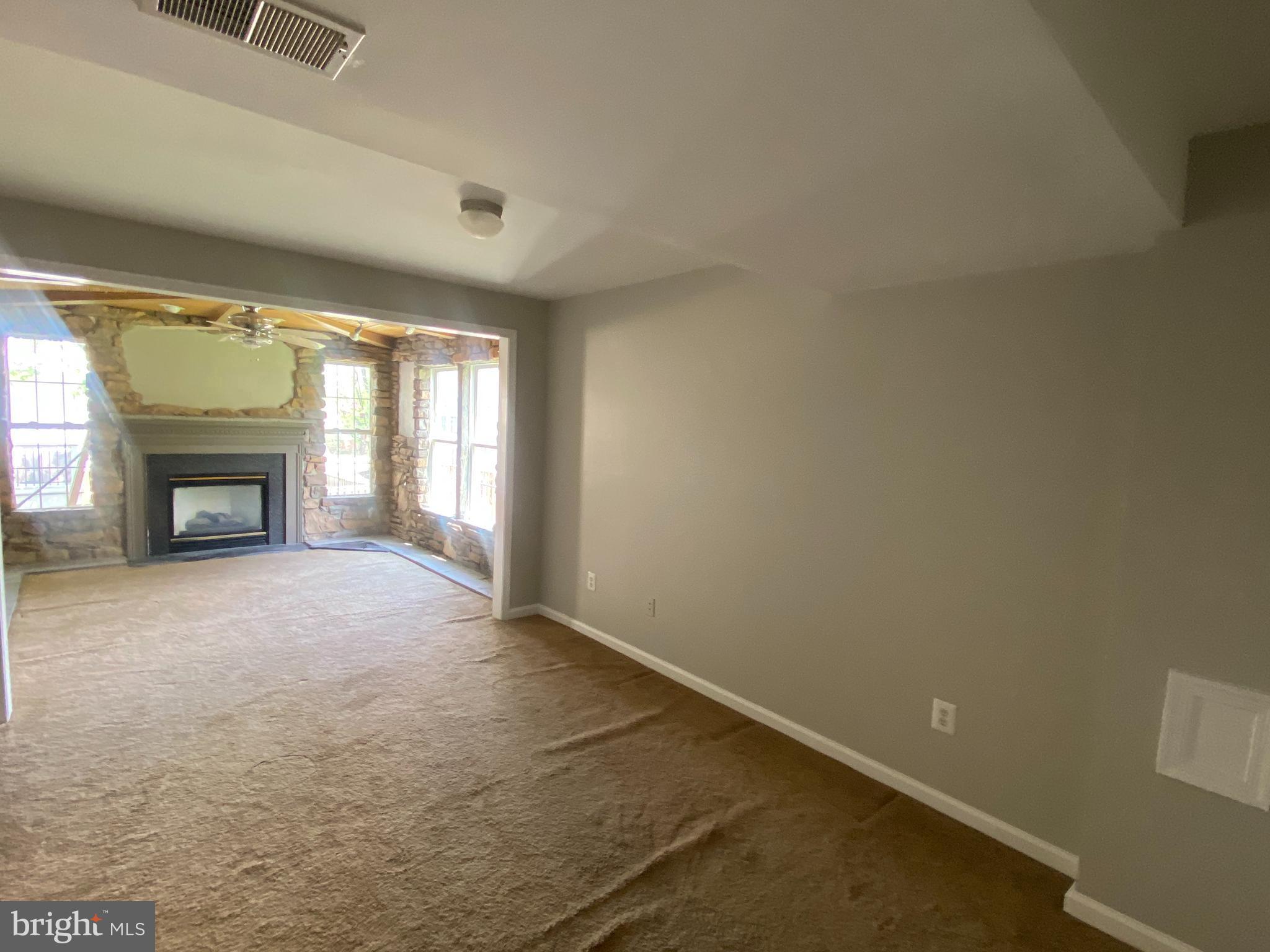 19958 Fieldgrass Square Ashburn, VA 20147 - Photo 13 of 14 a view of empty room with a fireplace