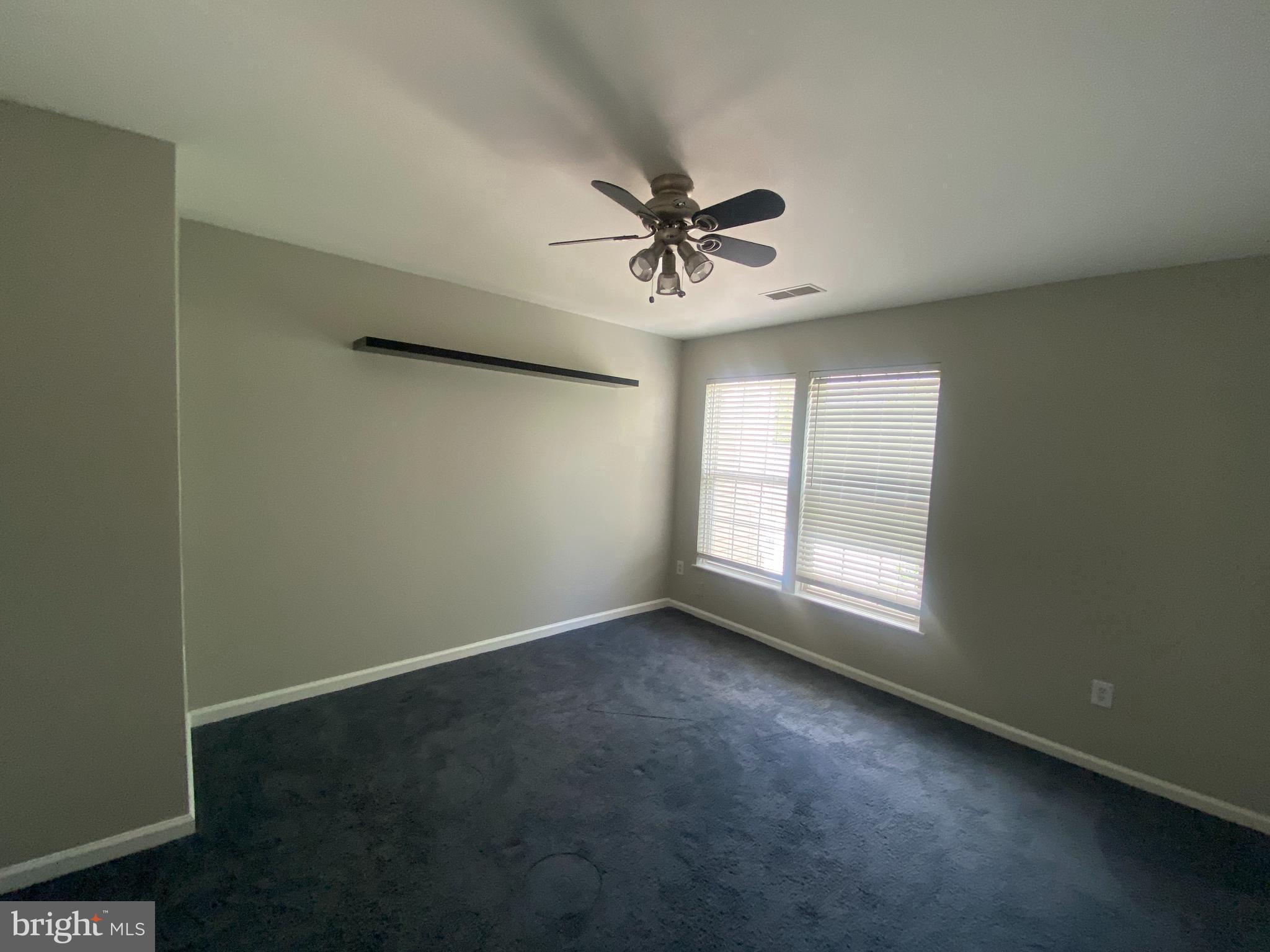 19958 Fieldgrass Square Ashburn, VA 20147 - Photo 6 of 14 a view of room with a ceiling fan and window