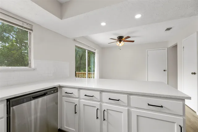 a view of cabinets and window