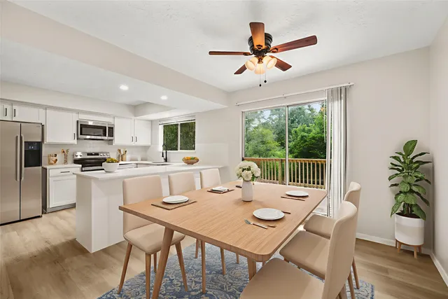 a view of a dining room with furniture window and wooden floor