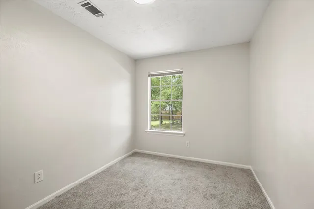 a view of hallway with white walls
