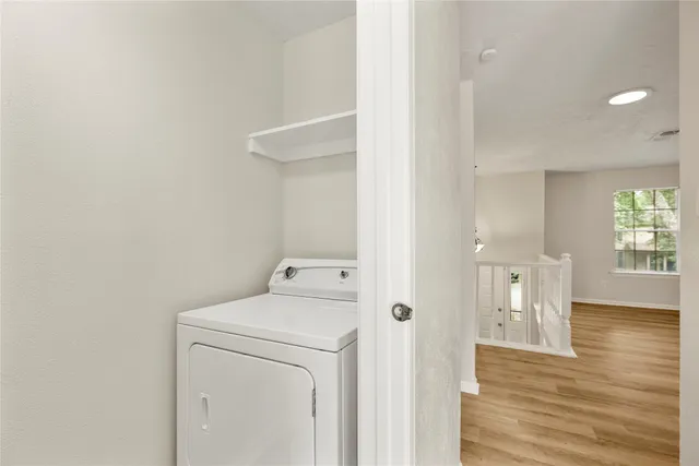 a view of storage and utility room with a fan