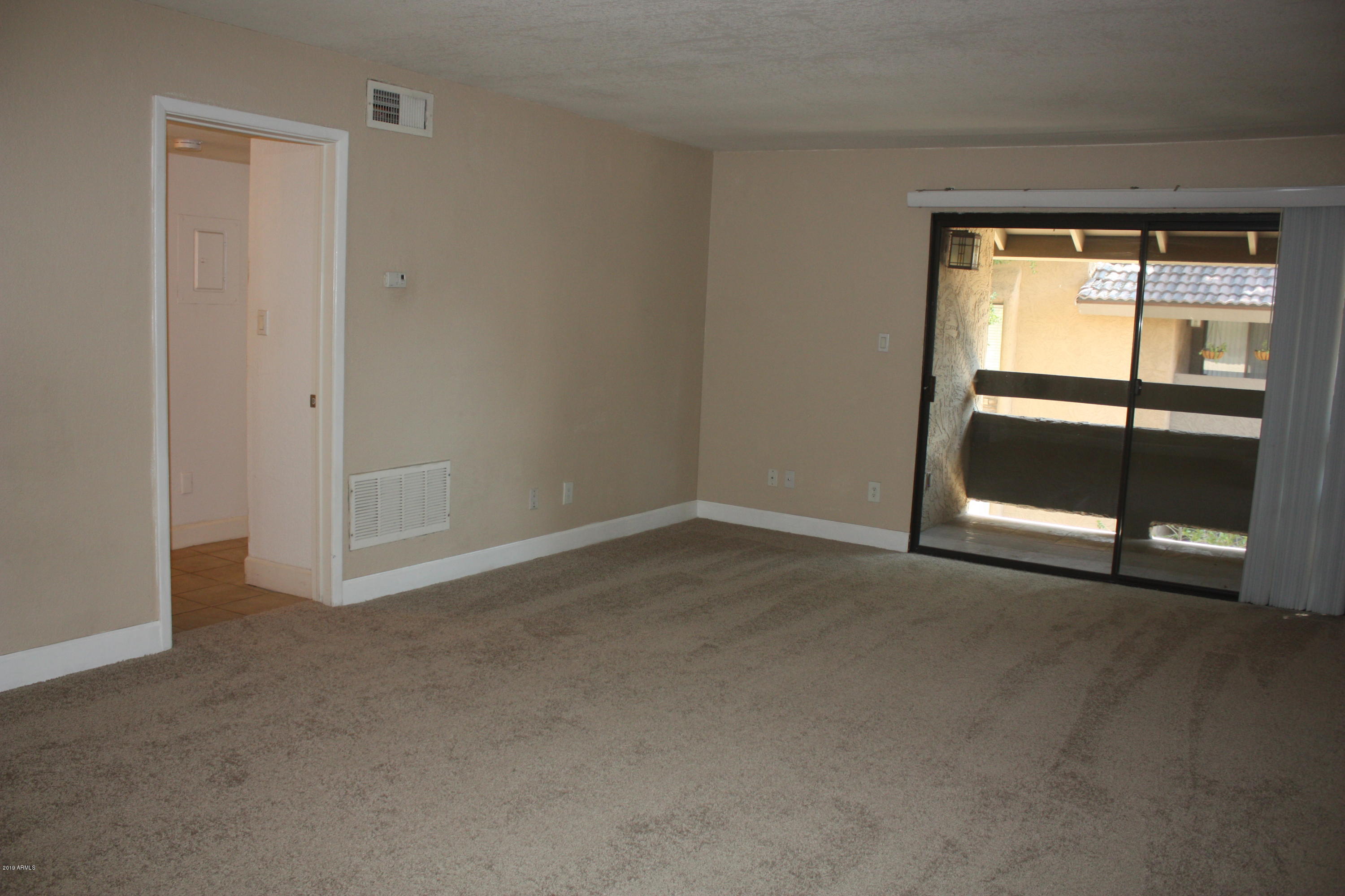 3825 East Camelback Road, Unit 281 Phoenix, AZ 85018 - Photo 7 of 19 living room 1