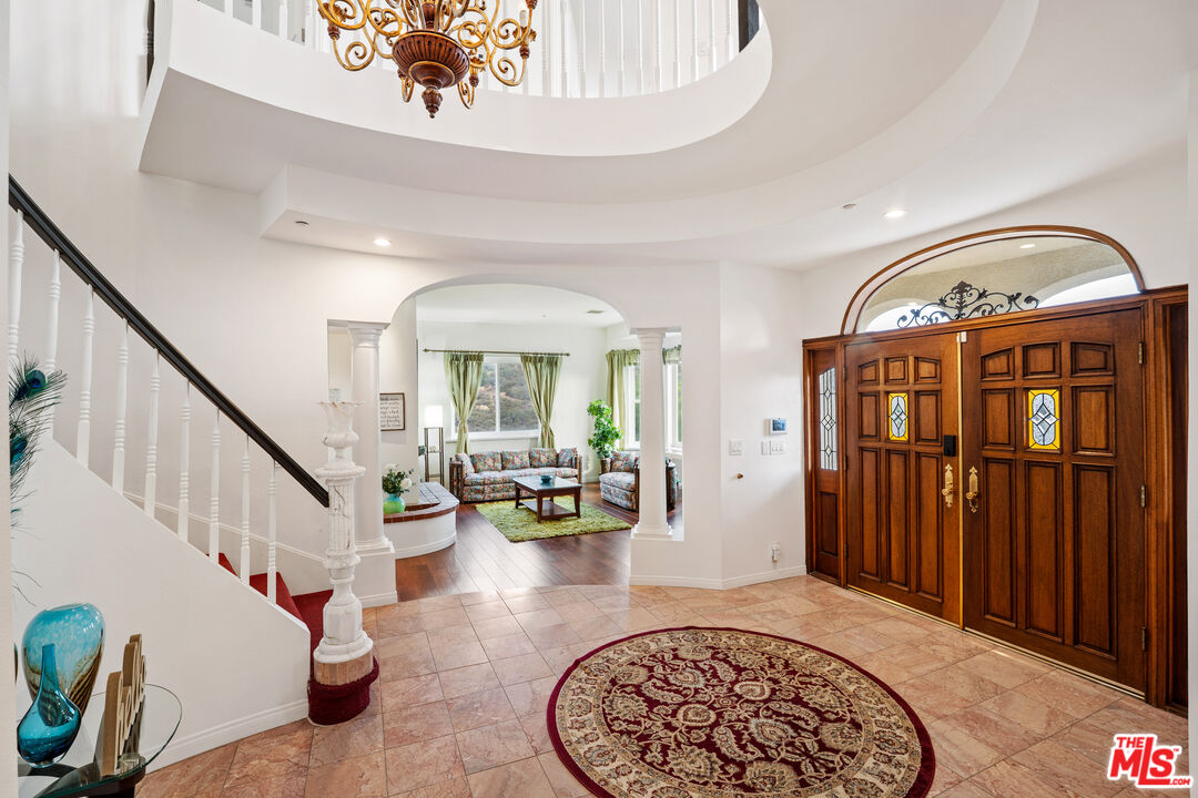 7449 Studio Road West Hills, CA 91304 - Photo 16 of 33 a view of an entryway with wooden floor