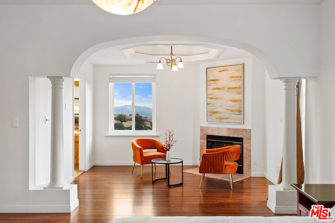 7449 Studio Road West Hills, CA 91304 - Photo 23 of 33 a living room with furniture and a fireplace