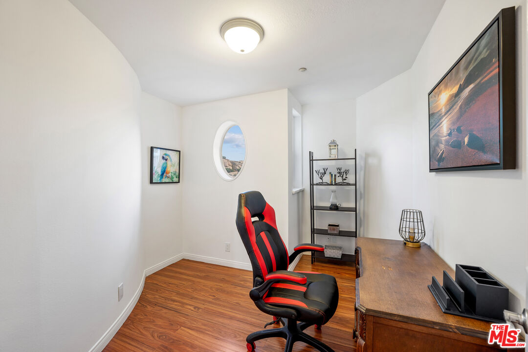 7449 Studio Road West Hills, CA 91304 - Photo 29 of 33 a workspace with furniture and wooden floor