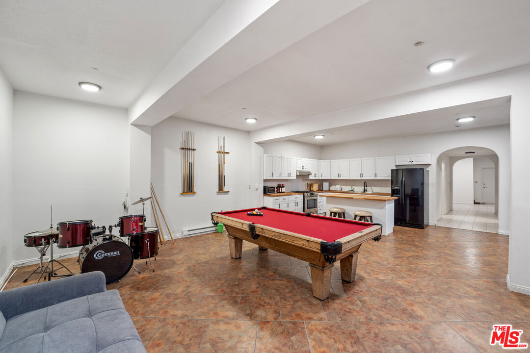 7449 Studio Road West Hills, CA 91304 - Photo 33 of 33 a living room with a pool table and furniture