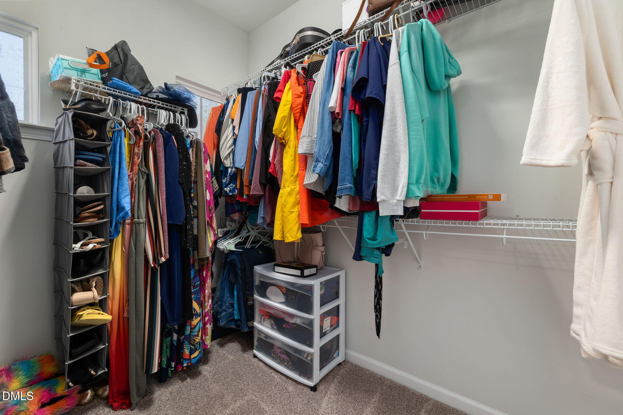 3422 Longleaf Estates Drive Raleigh, NC 27616 - Photo 43 of 71 a view of walk in closet with clothes and shoes