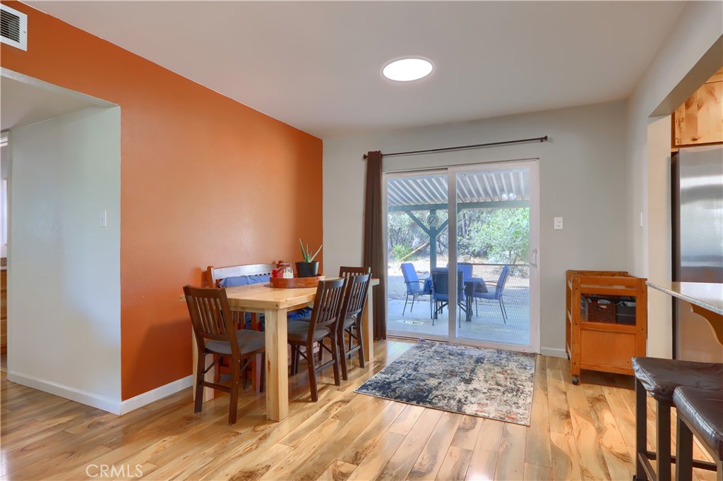 5268 Schafer Road Mariposa, CA 95338 - Photo 11 of 45 a view of a dining room with furniture window and wooden floor