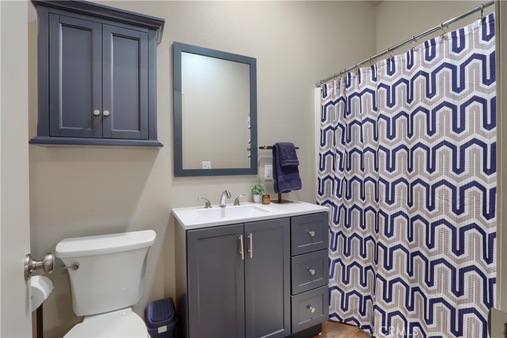 5268 Schafer Road Mariposa, CA 95338 - Photo 25 of 45 a bathroom with a toilet sink and mirror