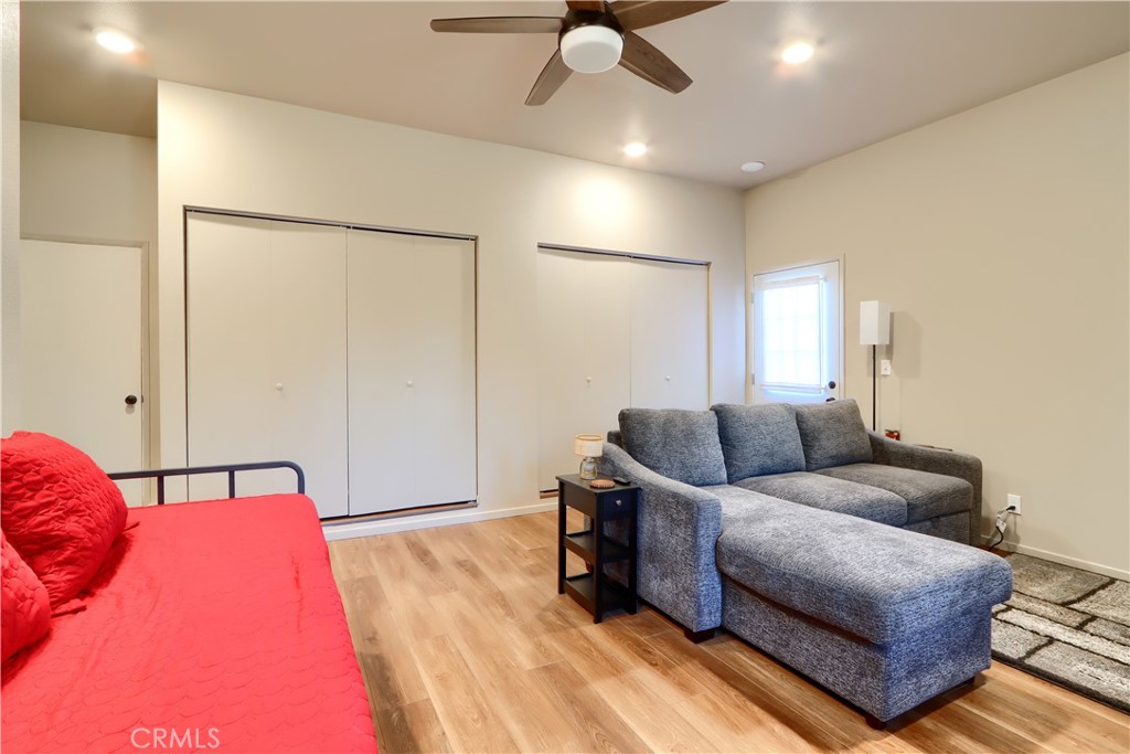 5268 Schafer Road Mariposa, CA 95338 - Photo 26 of 45 a bedroom with a bed and ceiling fan