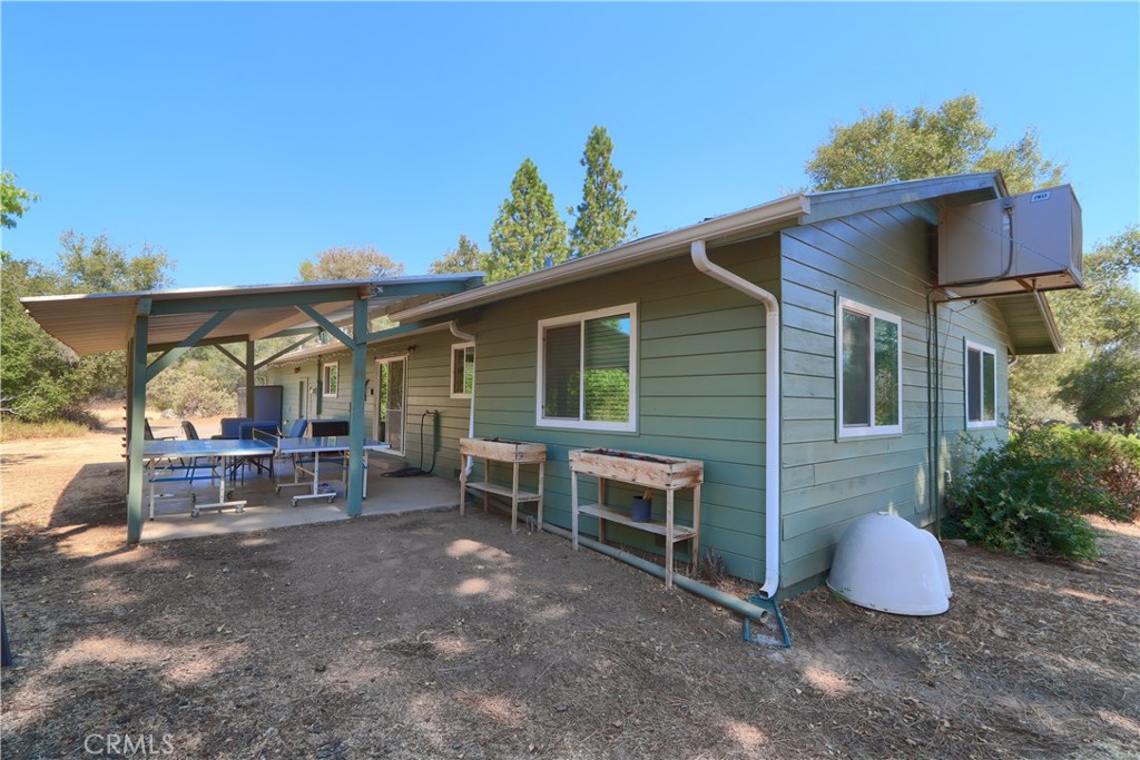 5268 Schafer Road Mariposa, CA 95338 - Photo 28 of 45 a view of house with a chairs and table in the patio
