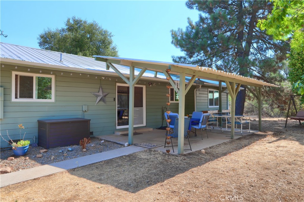 5268 Schafer Road Mariposa, CA 95338 - Photo 3 of 45 a view of a house with backyard porch and sitting area