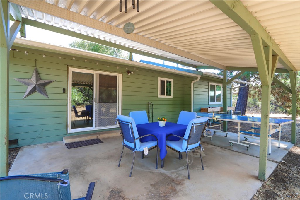 5268 Schafer Road Mariposa, CA 95338 - Photo 4 of 45 a view of a house with a backyard and sitting area