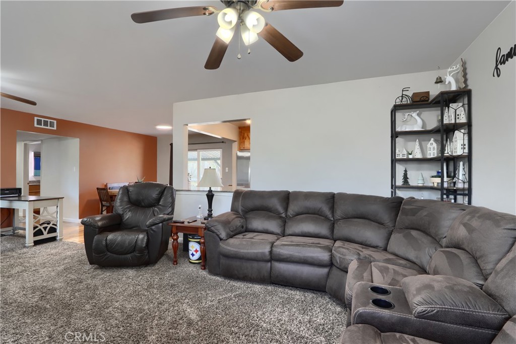 5268 Schafer Road Mariposa, CA 95338 - Photo 8 of 45 a living room with furniture and a flat screen tv