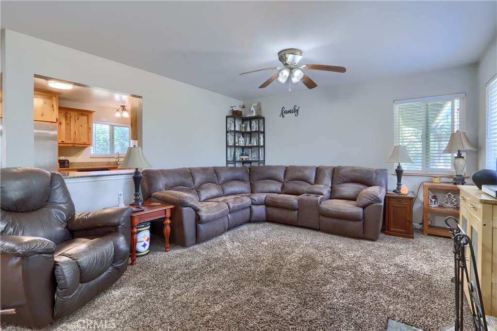 5268 Schafer Road Mariposa, CA 95338 - Photo 9 of 45 a living room with furniture and a chandelier