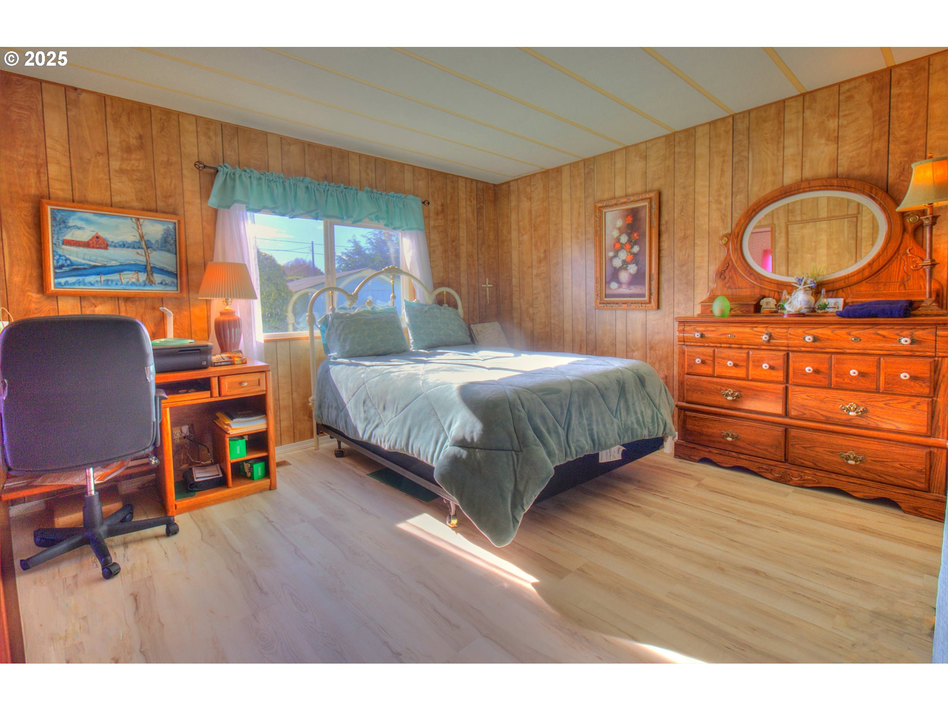 1109 Rowland Lane Brookings, OR 97415 - Photo 13 of 21 a bedroom with a bed and wooden floor