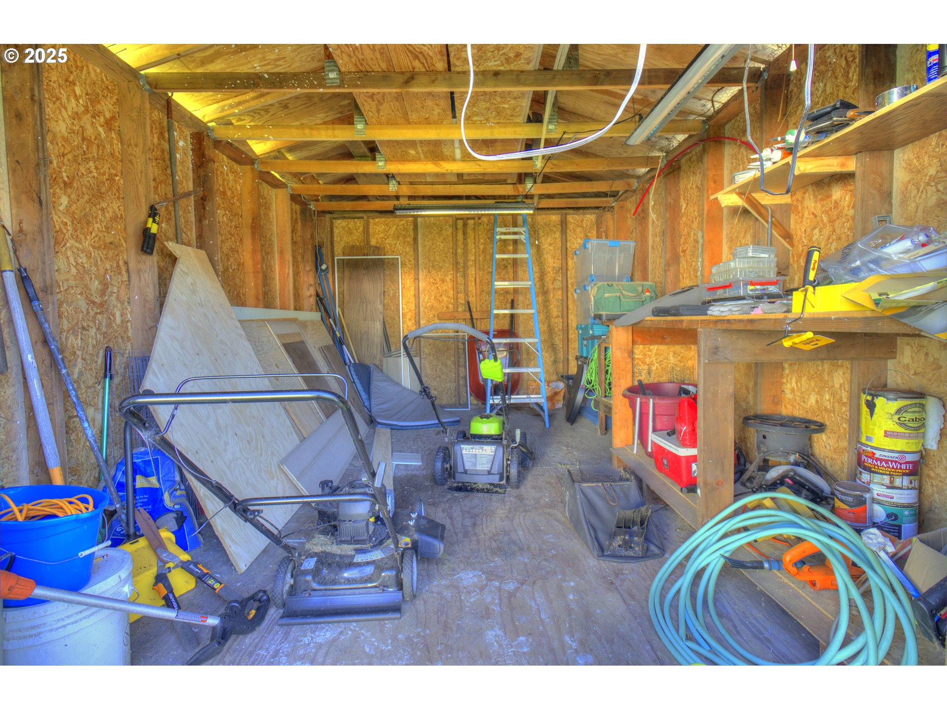 1109 Rowland Lane Brookings, OR 97415 - Photo 20 of 21 a view of garage with a table and chairs