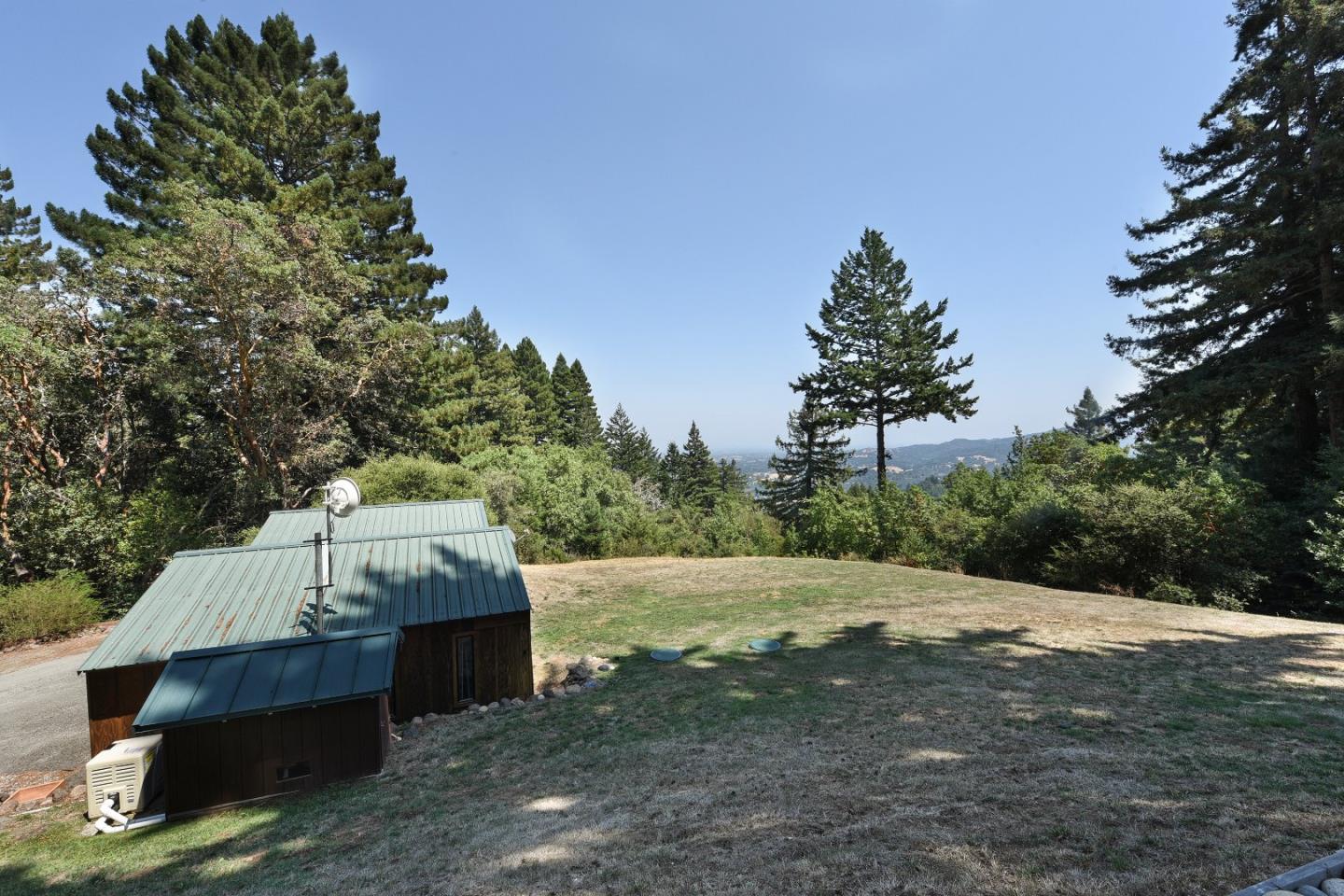 87 Upenuf Road Woodside, CA 94062 - Photo 12 of 42 a view of a wooden fence next to a yard