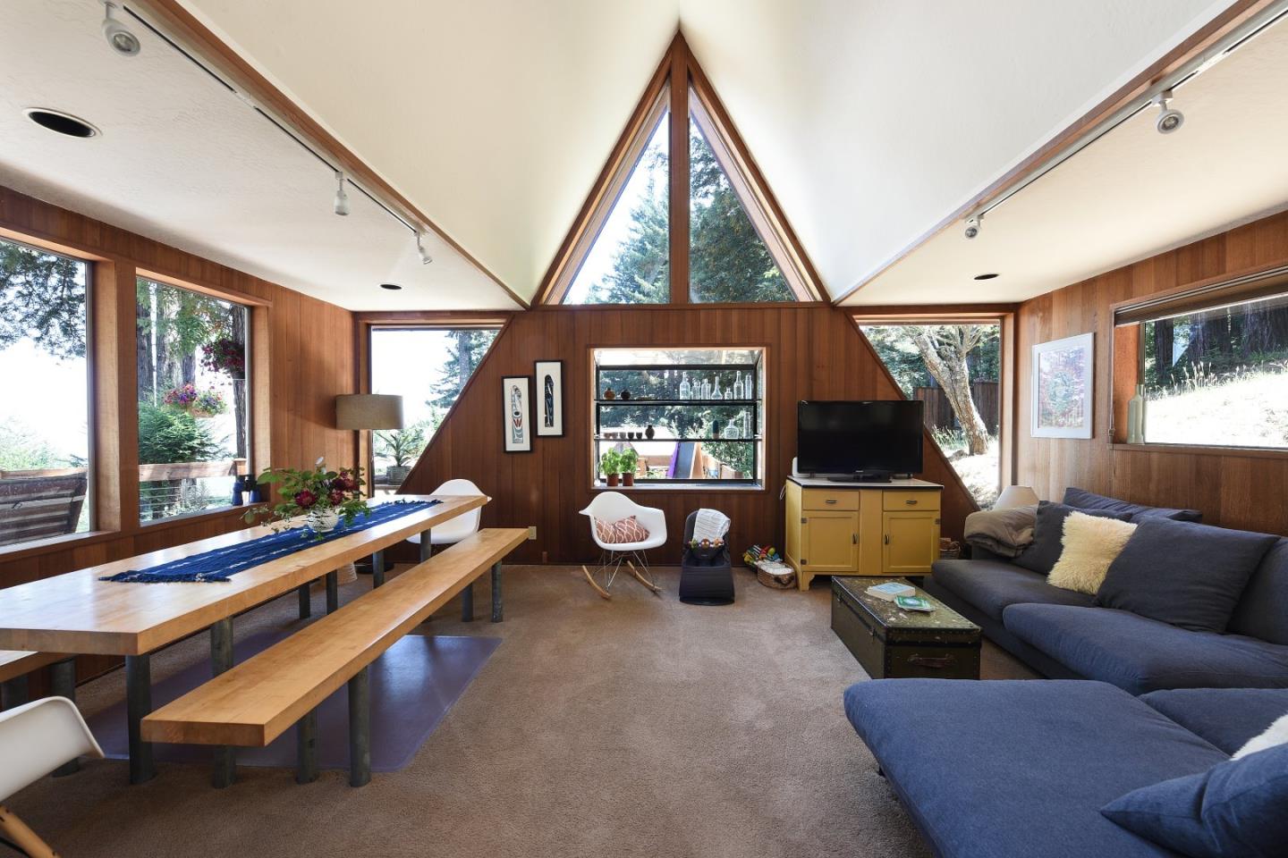 87 Upenuf Road Woodside, CA 94062 - Photo 18 of 42 a living room with furniture a flat screen tv and a large window