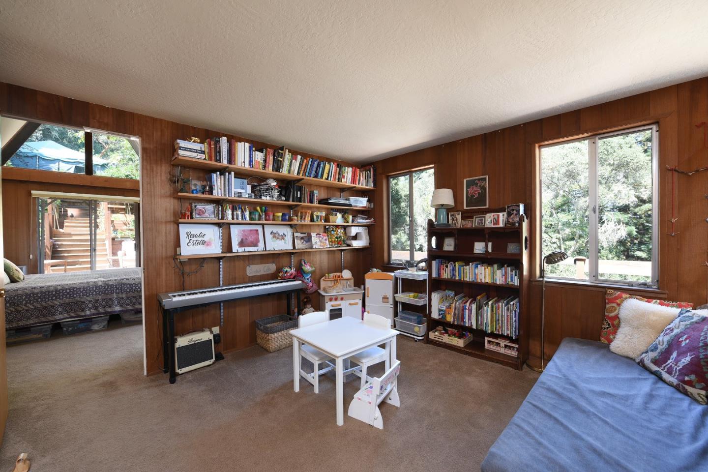 87 Upenuf Road Woodside, CA 94062 - Photo 22 of 42 a reading room with furniture and a book shelf